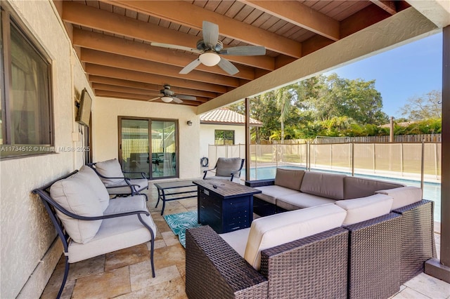 view of patio featuring ceiling fan, outdoor lounge area, and a fenced in pool