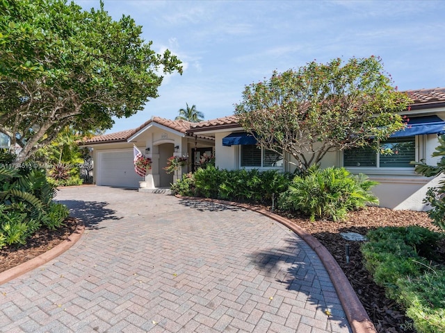 view of front of property with a garage