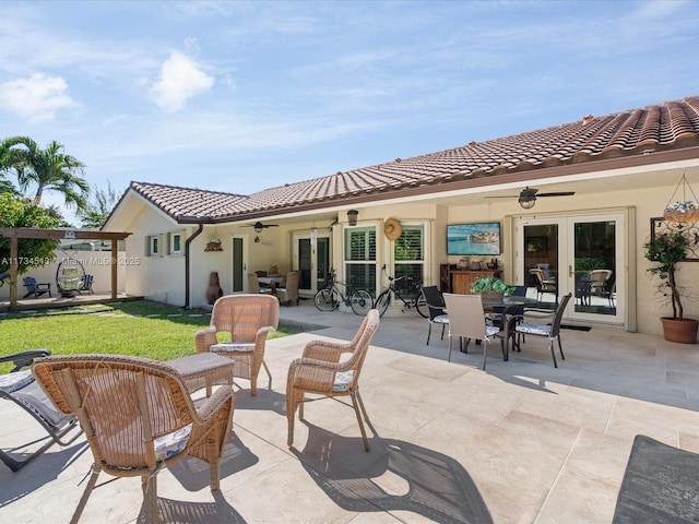 view of patio with ceiling fan and french doors