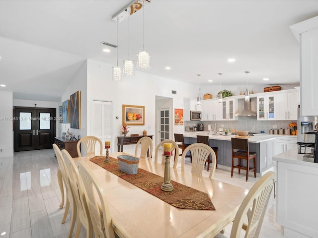 dining space featuring lofted ceiling