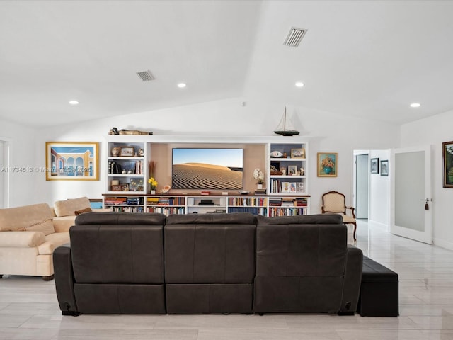 living room featuring vaulted ceiling