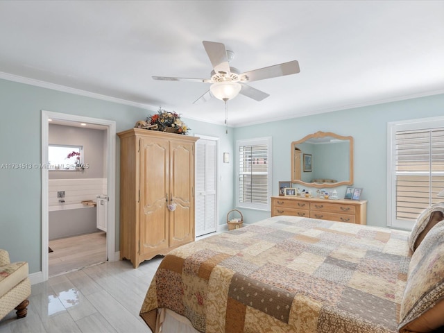 bedroom featuring ensuite bath, ornamental molding, light hardwood / wood-style floors, and ceiling fan