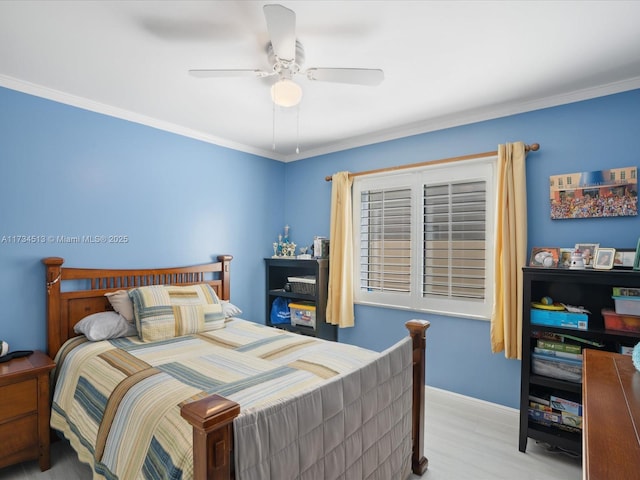 bedroom featuring crown molding, ceiling fan, and light wood-type flooring