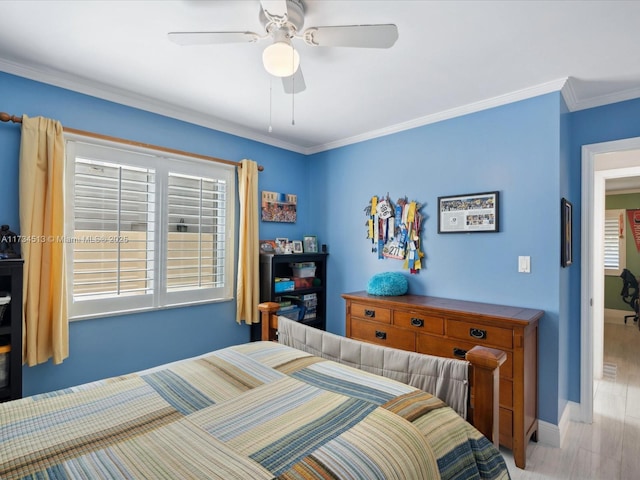 bedroom featuring ornamental molding, ceiling fan, and light hardwood / wood-style flooring