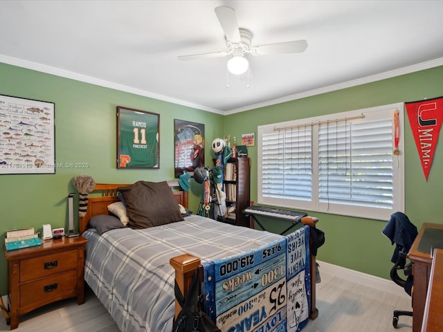 bedroom with ceiling fan, ornamental molding, and light hardwood / wood-style flooring