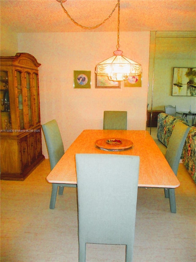 view of carpeted dining space