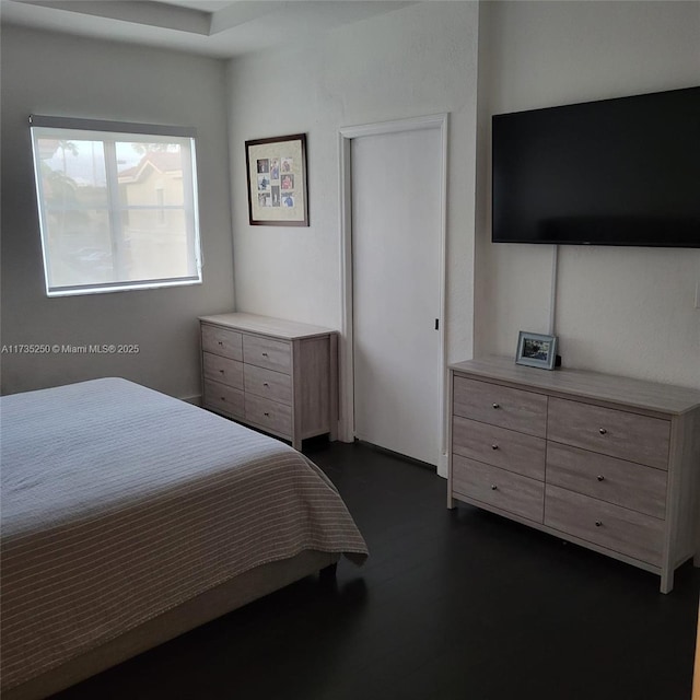 bedroom featuring dark hardwood / wood-style floors