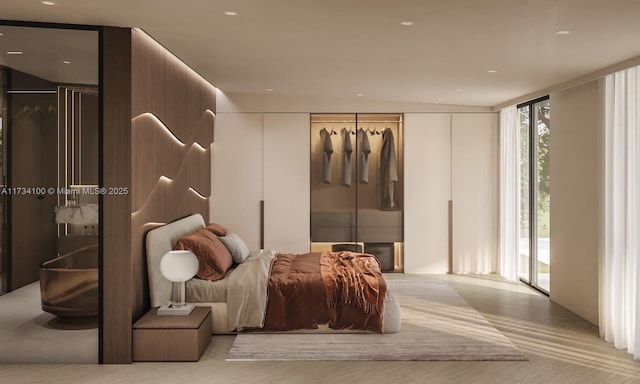 bedroom with a wall of windows and access to outside