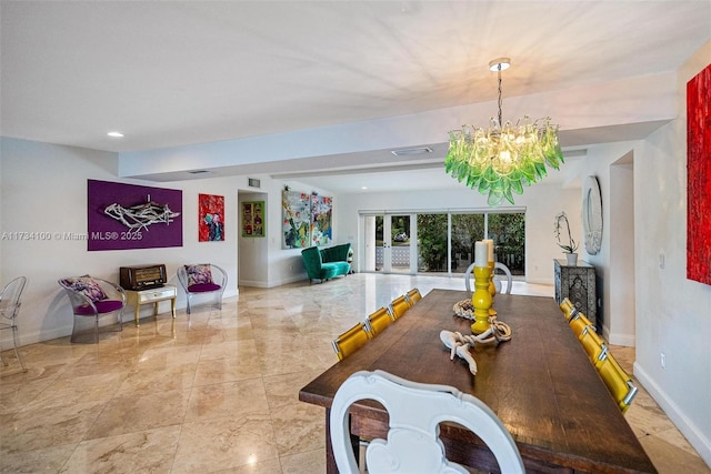 dining area with an inviting chandelier