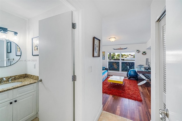 bathroom featuring vanity and wood-type flooring