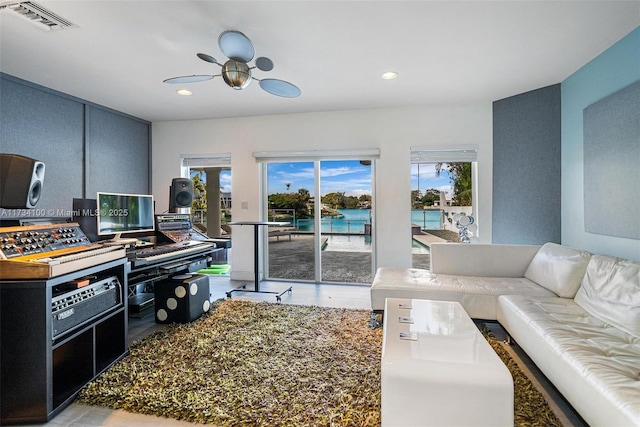 interior space with ceiling fan