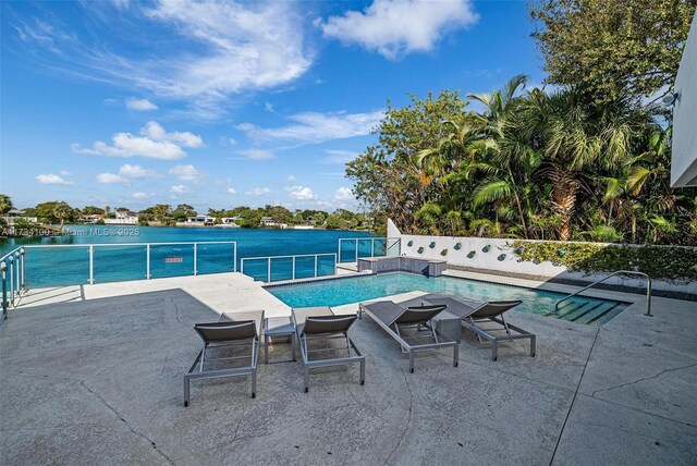 2091 NE 191st Dr, North Miami Beach, FL 33179 - view of pool with a patio area, a fenced in pool, and a water view