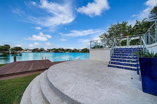 exterior space with a water view and a boat dock