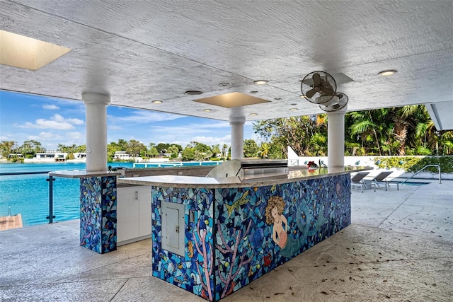 view of patio with ceiling fan