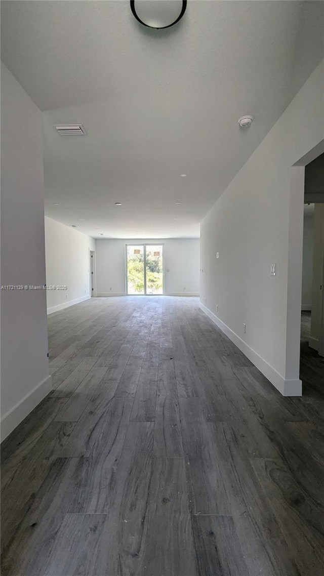 spare room with wood-type flooring