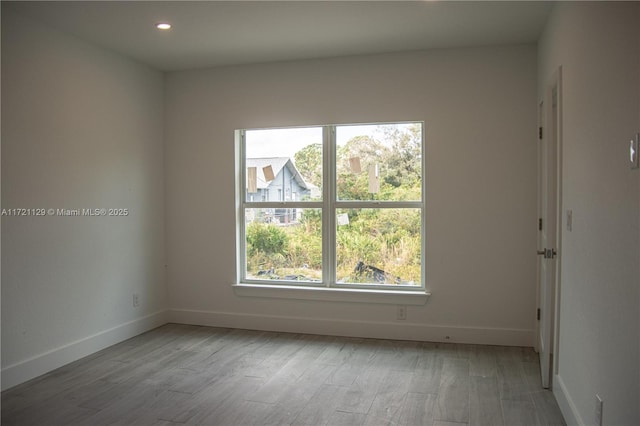 spare room featuring light hardwood / wood-style floors