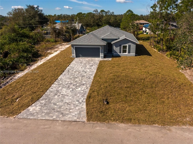 view of front facade featuring a garage and a front lawn