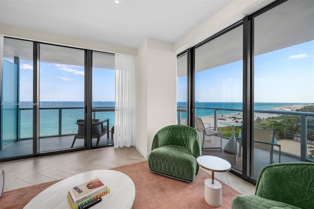 2201 Collins Ave Unit 1128, Miami Beach, FL 33139 - sitting room with a water view and baseboards