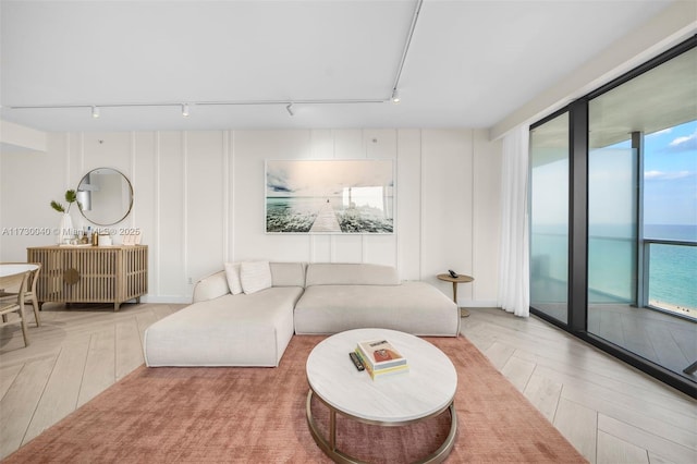 2201 Collins Ave Unit 1128, Miami Beach, FL 33139 - living room featuring rail lighting and a water view