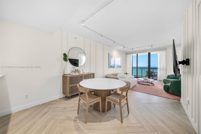2201 Collins Ave Unit 1128, Miami Beach, FL 33139 - dining space with rail lighting and baseboards