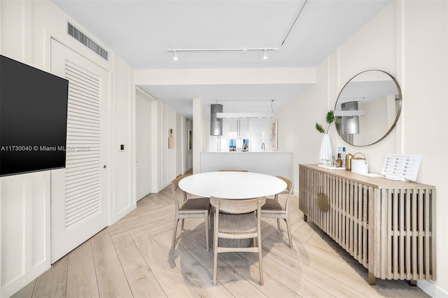 2201 Collins Ave Unit 1128, Miami Beach, FL 33139 - dining room featuring track lighting and attic access