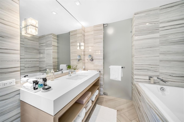 2201 Collins Ave Unit 1128, Miami Beach, FL 33139 - full bath with a bath, vanity, and tile walls