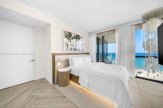2201 Collins Ave Unit 1128, Miami Beach, FL 33139 - bedroom featuring access to exterior and a water view
