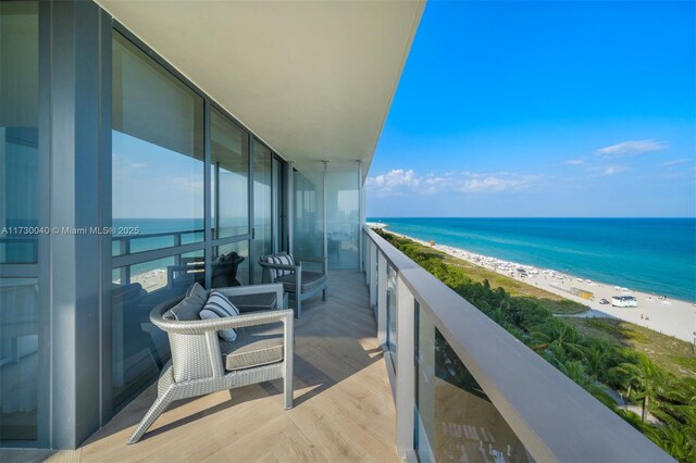 2201 Collins Ave Unit 1128, Miami Beach, FL 33139 - balcony featuring view of water and beach