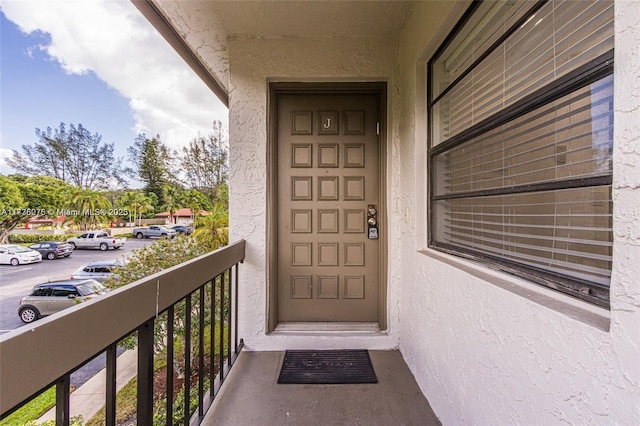 doorway to property with a balcony