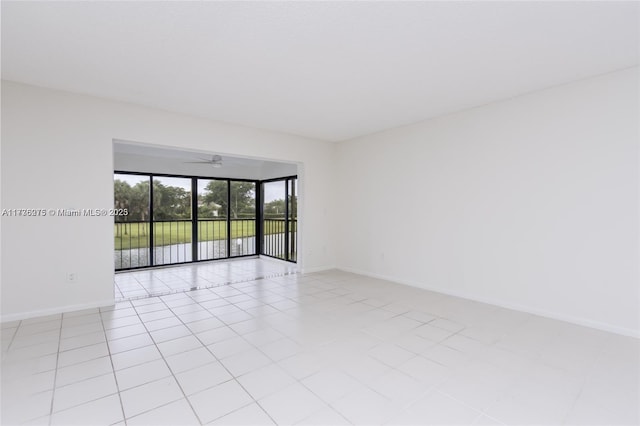 unfurnished room with light tile patterned flooring and ceiling fan