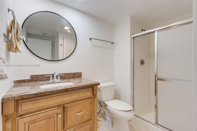 bathroom with vanity, toilet, and walk in shower