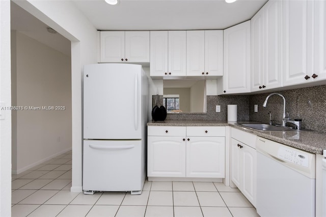 kitchen with white cabinetry, sink, light tile patterned floors, and white appliances