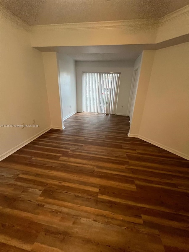 2494 Centergate Dr Unit 103, Miramar, FL 33025 - empty room with baseboards, dark wood-style flooring, and a textured ceiling