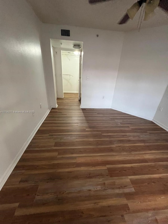 2494 Centergate Dr Unit 103, Miramar, FL 33025 - spare room featuring baseboards, ceiling fan, visible vents, and wood finished floors