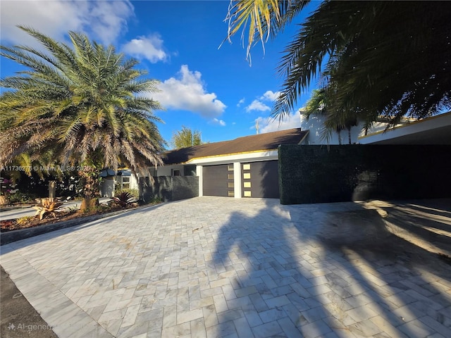 view of property exterior with a garage