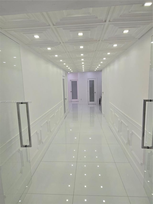 hallway with light tile patterned floors