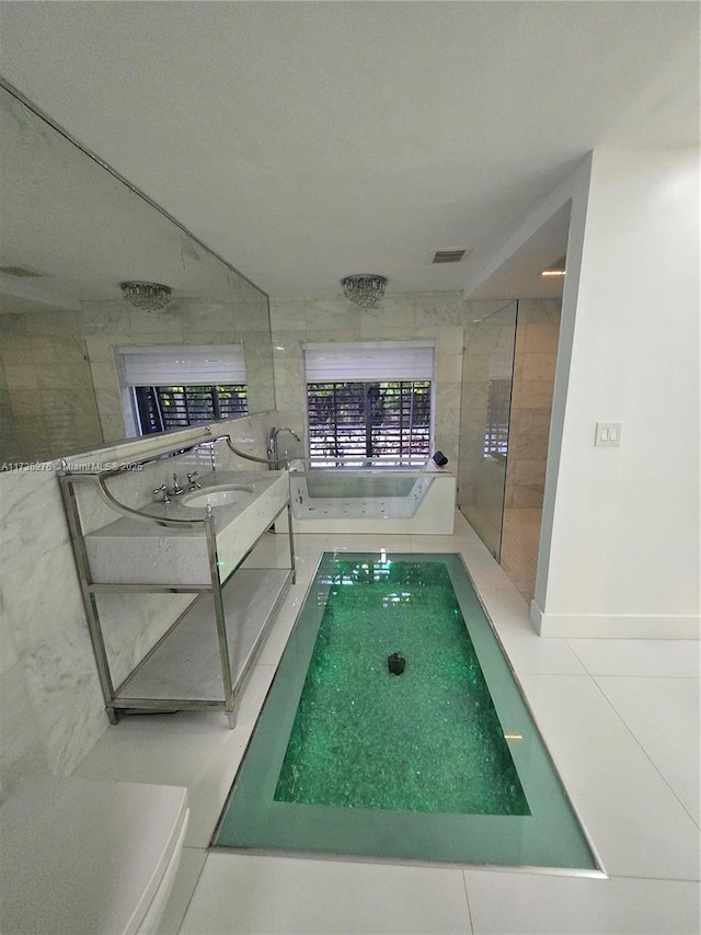 view of pool featuring sink and a hot tub