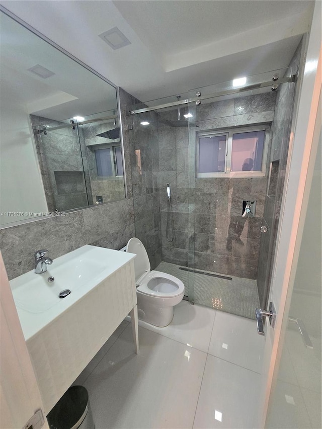 bathroom featuring tile walls, backsplash, vanity, walk in shower, and toilet