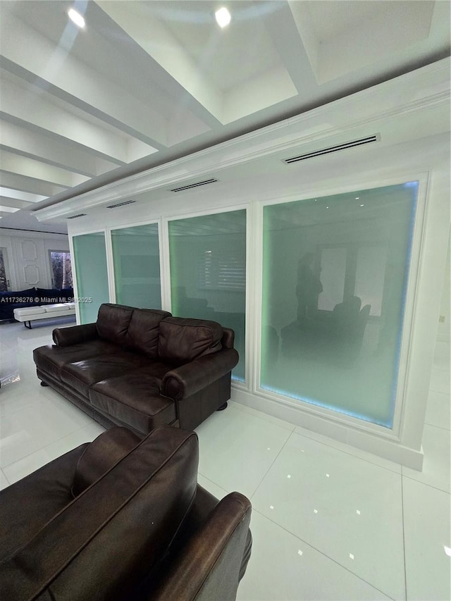 living room with coffered ceiling, tile patterned flooring, and beam ceiling