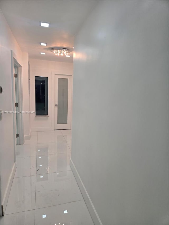 hallway featuring light tile patterned flooring