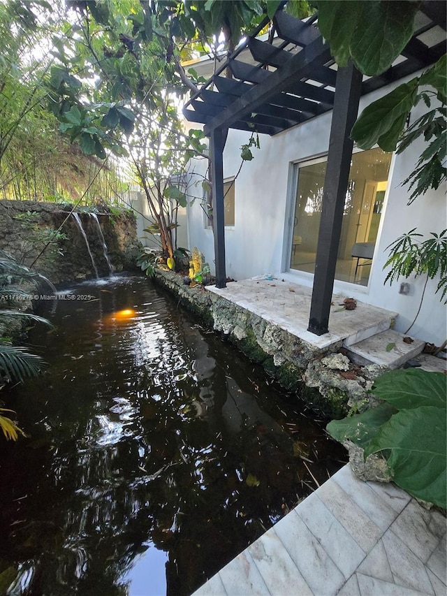 view of patio featuring a pergola