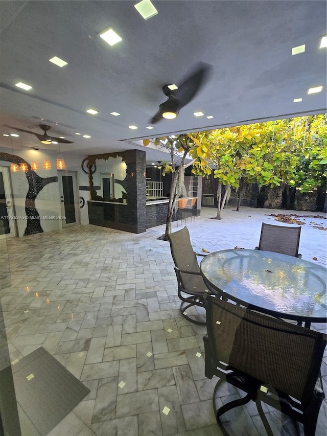 view of patio featuring ceiling fan