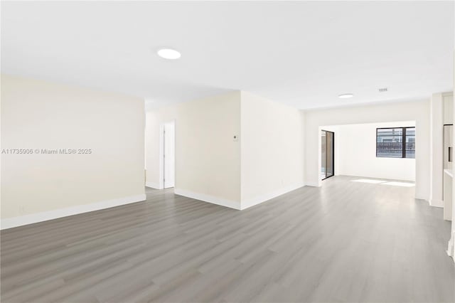 unfurnished room featuring hardwood / wood-style floors