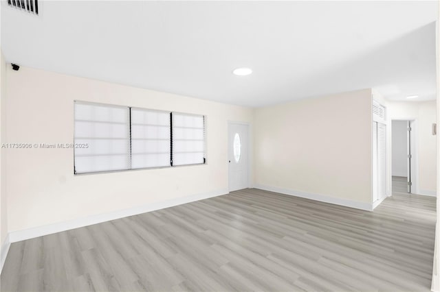 unfurnished room featuring light wood-type flooring