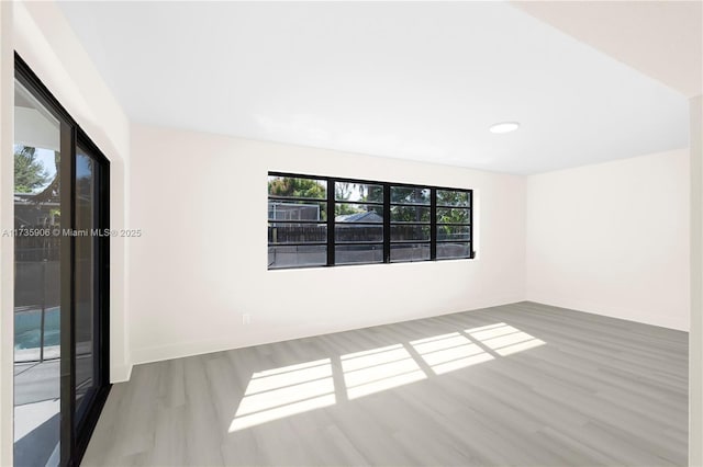 empty room featuring hardwood / wood-style flooring