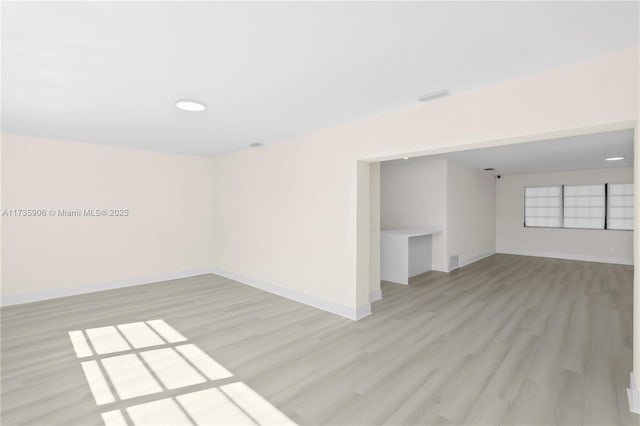 unfurnished room featuring light hardwood / wood-style flooring