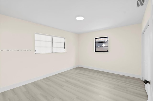 unfurnished room featuring light wood-type flooring