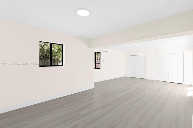 spare room featuring light wood-type flooring