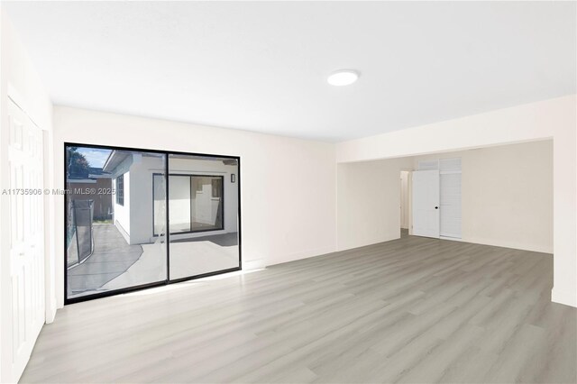 spare room featuring light hardwood / wood-style floors