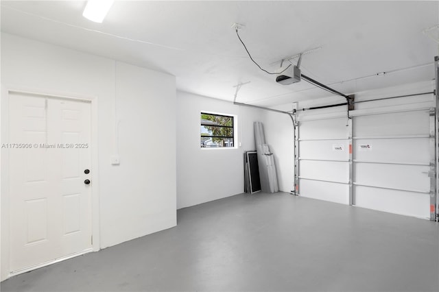 garage featuring a garage door opener